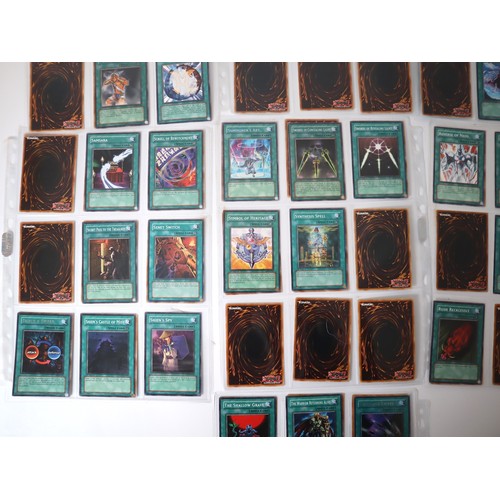 159 - A group of approximately 200 Yu-Gi-Oh Spell Trading Cards including singles from collectors tins , s... 