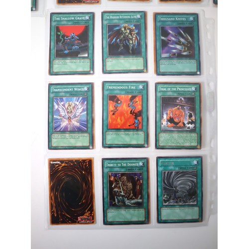 159 - A group of approximately 200 Yu-Gi-Oh Spell Trading Cards including singles from collectors tins , s... 