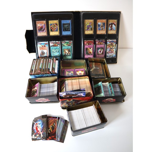 157 - A group of Yu-Gi-Oh Trading cards from 2005-2010 with collectbale tins, constructed decks with liter... 