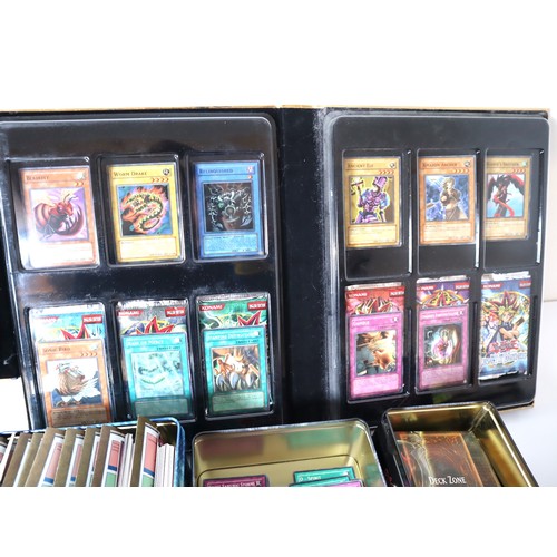 157 - A group of Yu-Gi-Oh Trading cards from 2005-2010 with collectbale tins, constructed decks with liter... 