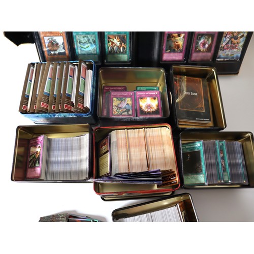 157 - A group of Yu-Gi-Oh Trading cards from 2005-2010 with collectbale tins, constructed decks with liter... 