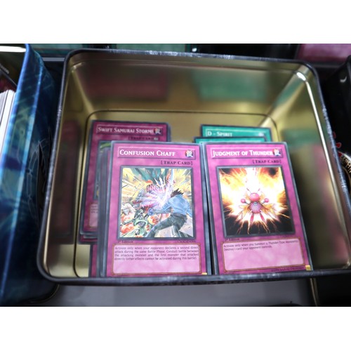 157 - A group of Yu-Gi-Oh Trading cards from 2005-2010 with collectbale tins, constructed decks with liter... 