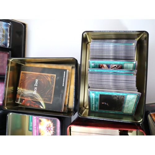 157 - A group of Yu-Gi-Oh Trading cards from 2005-2010 with collectbale tins, constructed decks with liter... 