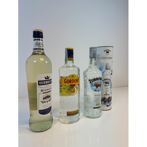 166 - Three bottles of spirits including Vermouth Bianco, Gordons Gin, Zubrowka Vodka