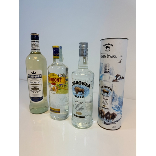 166 - Three bottles of spirits including Vermouth Bianco, Gordons Gin, Zubrowka Vodka