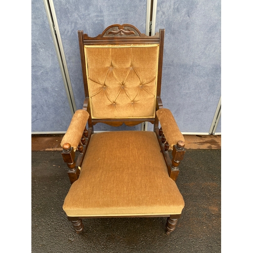 501 - Antique upholstered arm chair.