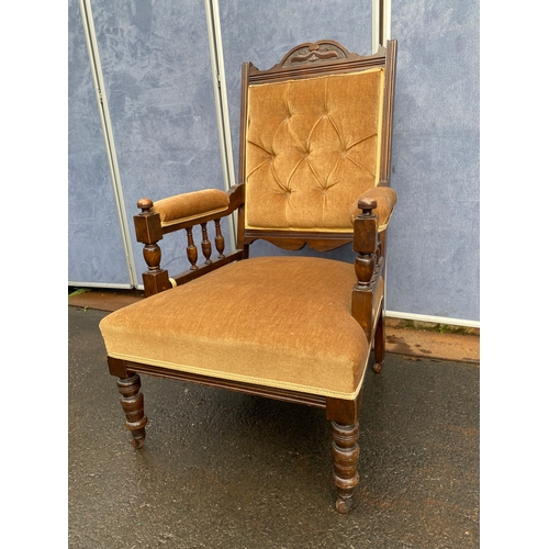 501 - Antique upholstered arm chair.