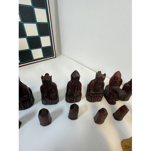 303 - A collection of Chess and Draughts pieces