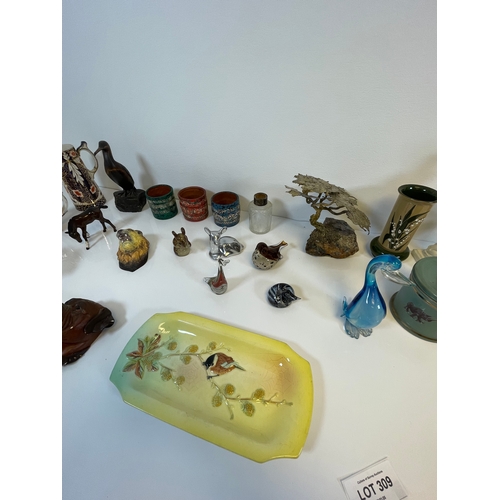 309 - A large lot of miscellaneous collectable ceramics and glass items.