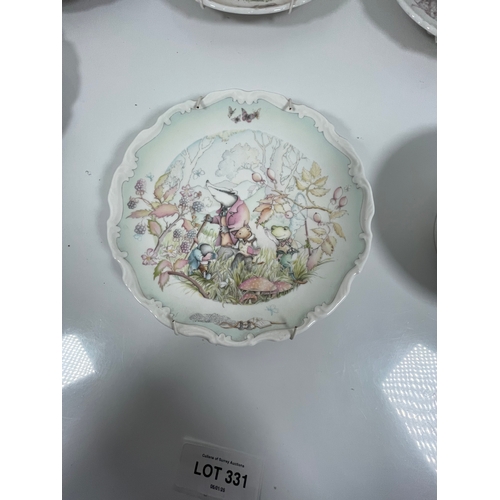 331 - A collection of Royal Doulton Wind and the Willows plates with Winnie the Pooh bowl.