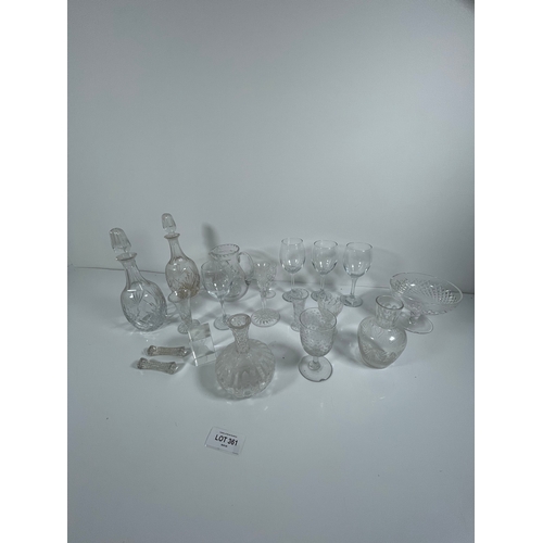 361 - A collection of crystal and glass decanters, vases jugs and wine glasses.