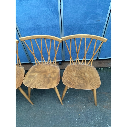 532 - Mid Century Ercol drop leaf plank table and four Ercol Candlestick chairs.