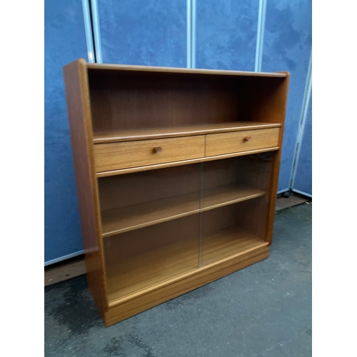 536 - Mid century Nathan glass front low book shelf with two drawers