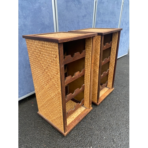 548 - A pair of wicker/rattan wine racks.