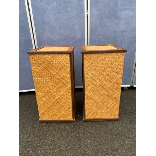 548 - A pair of wicker/rattan wine racks.