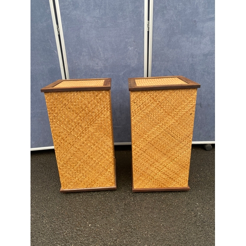 548 - A pair of wicker/rattan wine racks.