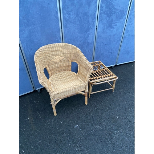 551 - Wicker/ cane armchair with side table.