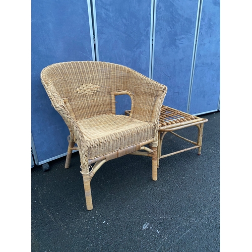 551 - Wicker/ cane armchair with side table.