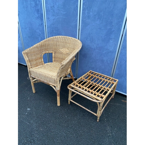 551 - Wicker/ cane armchair with side table.