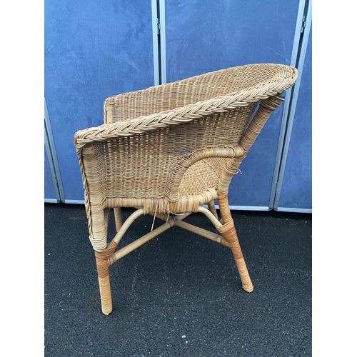 551 - Wicker/ cane armchair with side table.