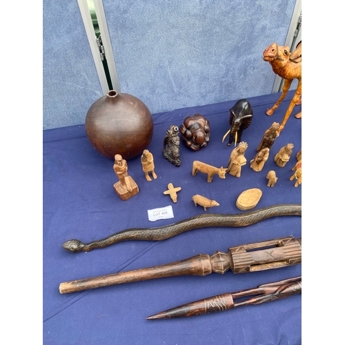 408 - A collection of wooden figures/ornaments and carved sticks.