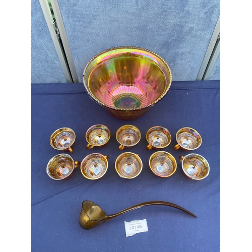 409 - Interesting colourful glass punch bowl and 10 cups with plastic ladle.