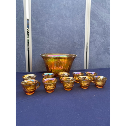 409 - Interesting colourful glass punch bowl and 10 cups with plastic ladle.