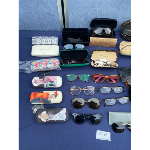 413 - Large collection of Miscellaneous Sun glasses/ reading glasses and cases