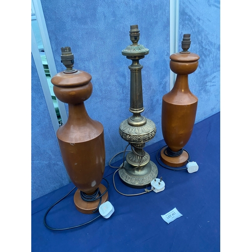 421 - A pair of wooden and one decorative table lamps