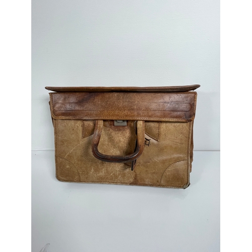 393 - A collection of Satchels/ Brief cases