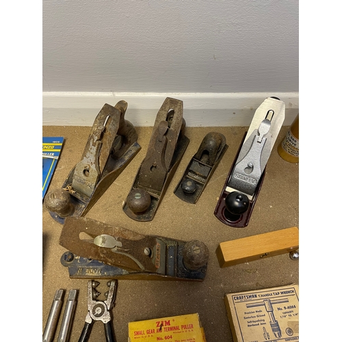 395 - A collection of vintage tools including wood planes.