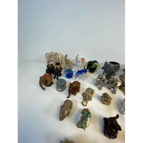 490 - A collection of Elephant related trinkets and ornaments.