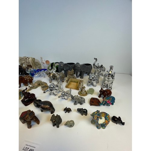 490 - A collection of Elephant related trinkets and ornaments.