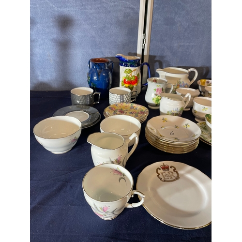 587 - Large quantity of collectable ceramic plates, cups and jugs.