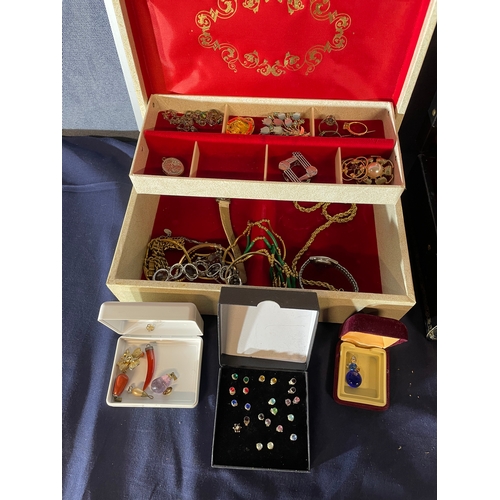 591 - A large collection of costume jewellery and three boxes.