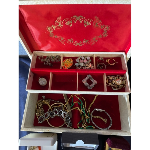 591 - A large collection of costume jewellery and three boxes.