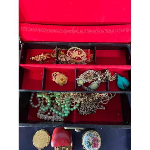 591 - A large collection of costume jewellery and three boxes.