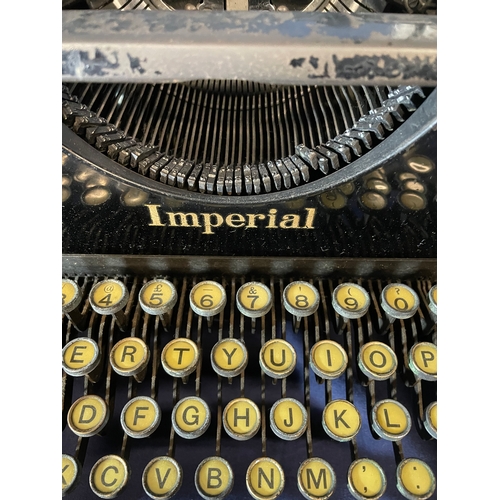 596 - Two Vintage type writers