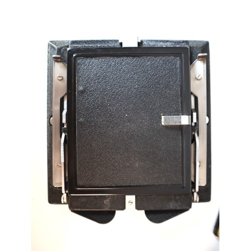 74 - Quantity of Large Format Camera parts including focusing hood ground glass, hard case of lens boards