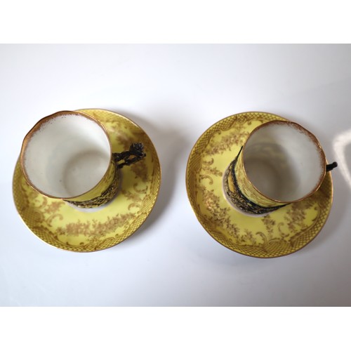 165 - A pair of 19th century Crown Staffordshire Egg Shell Tea Cups and saucers with Sterling Silver Holde... 