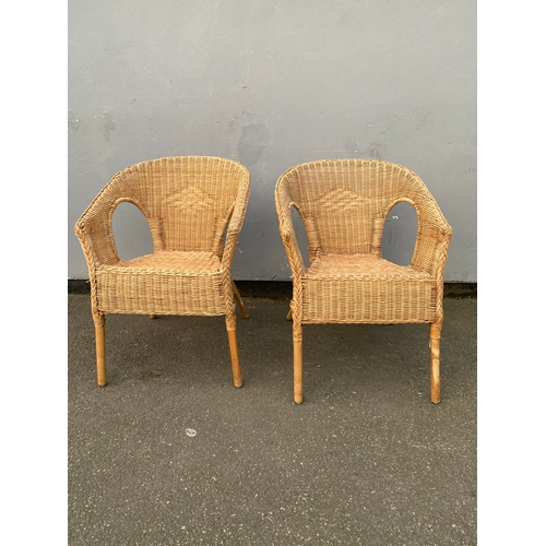 Two matching Wicker arm chairs