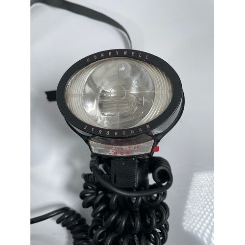 645 - A large quantity of Photography/lighting equipment including Sunpak auto zoom 3600 Thyristor, Honeyw... 