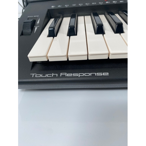 249 - Yamaha PSR-400 Electric keyboard and stand.