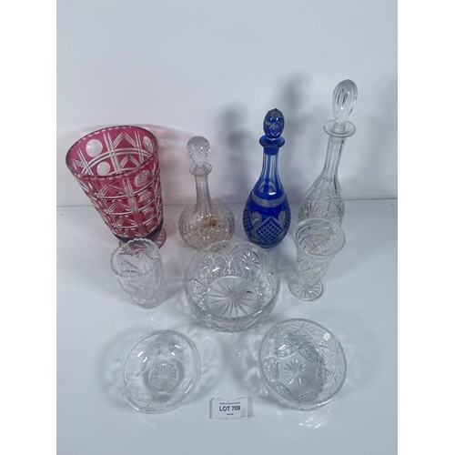 709 - A collection of Crystal and class Vases, Bowls and decanters.