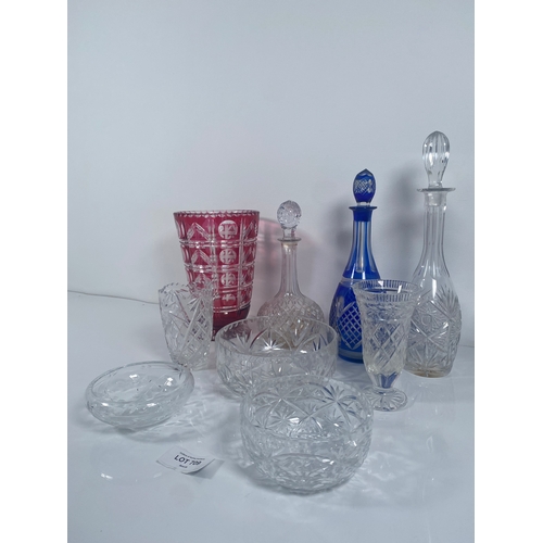 709 - A collection of Crystal and class Vases, Bowls and decanters.