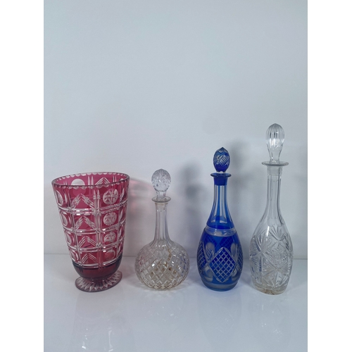 709 - A collection of Crystal and class Vases, Bowls and decanters.