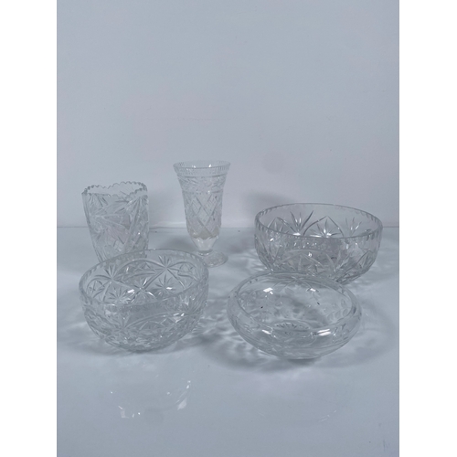 709 - A collection of Crystal and class Vases, Bowls and decanters.