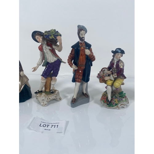 711 - Four ceramic collectable figurines and Two Wedgwood Vases