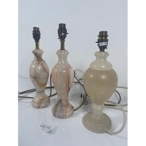 714 - Three onyx/Marble Table lamps.