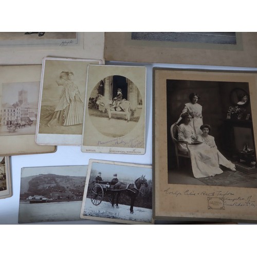 219 - A collection of late 19th - early 20th century black and white photographs / social history includin... 